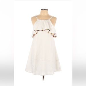 Small white dress with colorful pompoms